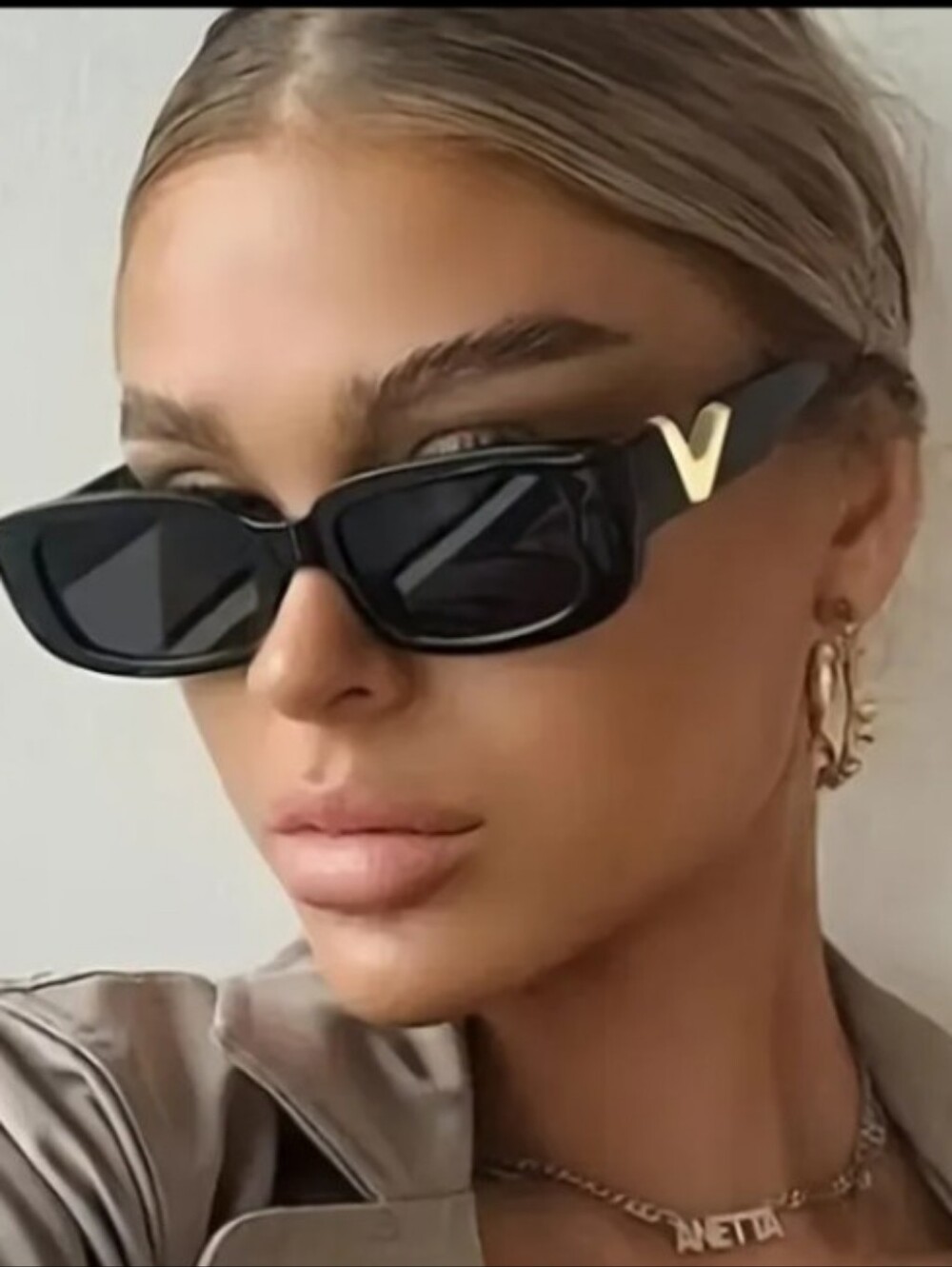 Black Cat-Eye Sunglasses with Gold 'V' Accent - Designer Style